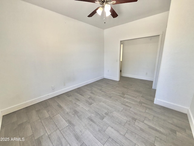 7116 W Sophie Ln, Laveen, AZ 85339 - unfurnished room with ceiling fan, wood finished floors, and baseboards