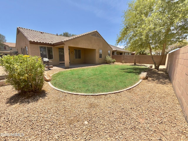 7116 W Sophie Ln, Laveen, AZ 85339 - rear view of house with stucco siding, a patio area, and a tiled roof