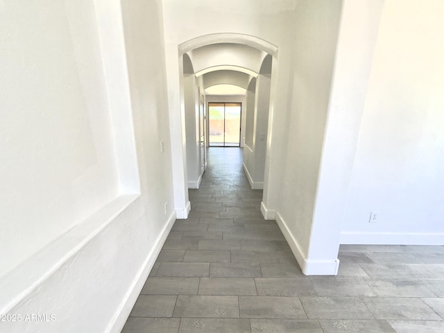 7116 W Sophie Ln, Laveen, AZ 85339 - hall with arched walkways and baseboards