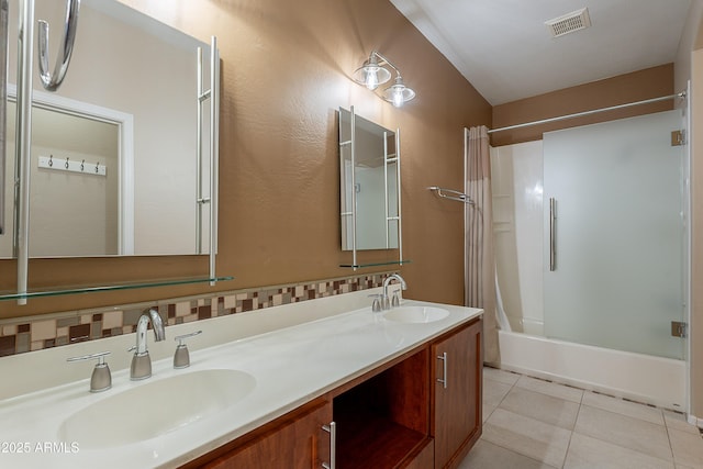 bathroom featuring a sink, tile patterned flooring, shower / bathtub combination with curtain, and visible vents