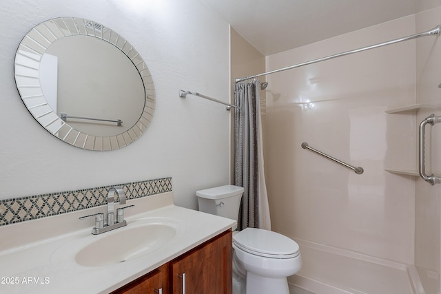 bathroom featuring vanity, toilet, and a shower with shower curtain