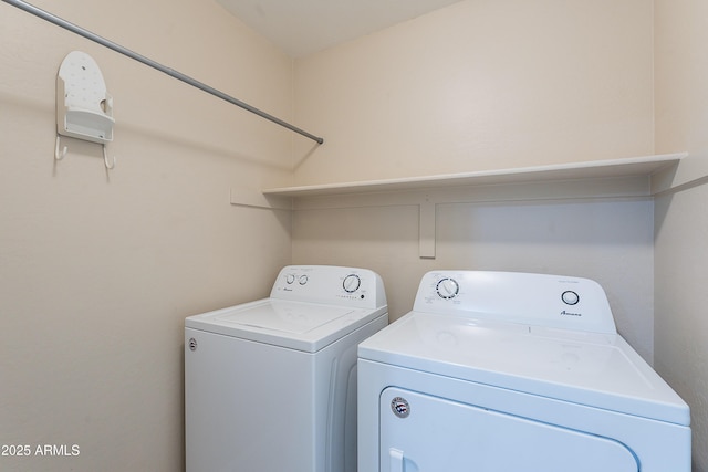 laundry room with laundry area and washing machine and clothes dryer
