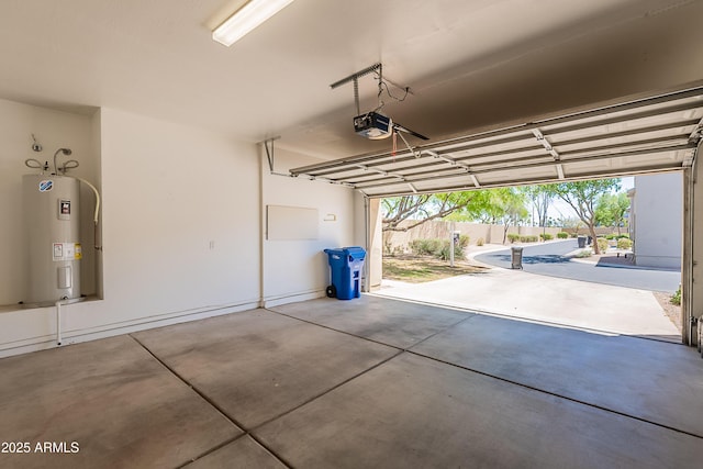garage with a garage door opener and water heater