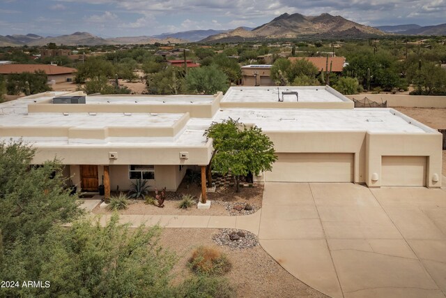 birds eye view of property featuring a mountain view