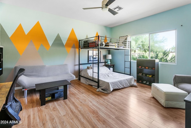 bedroom with visible vents and wood finished floors