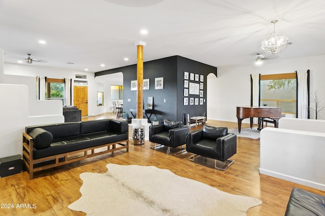 living area featuring light wood-type flooring, plenty of natural light, and recessed lighting