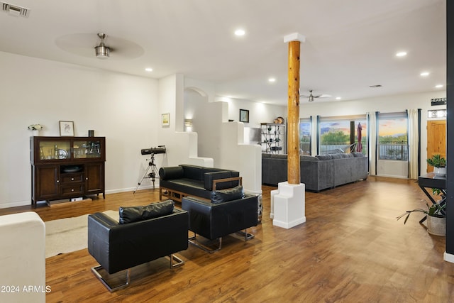 living room with ceiling fan, visible vents, wood finished floors, and recessed lighting