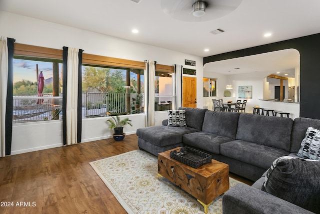 living room featuring recessed lighting, visible vents, ceiling fan, wood finished floors, and baseboards