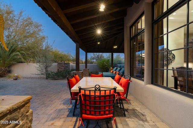 view of patio terrace at dusk