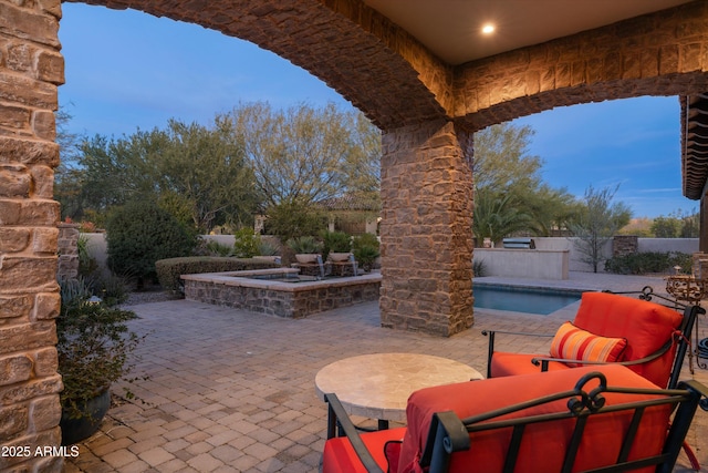 view of patio featuring a pool with hot tub