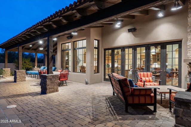 view of patio / terrace featuring an outdoor living space and french doors