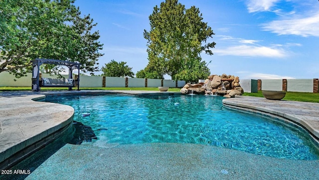 pool featuring a patio area, a pergola, and fence