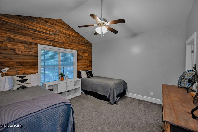 bedroom with carpet, wood walls, baseboards, ceiling fan, and vaulted ceiling