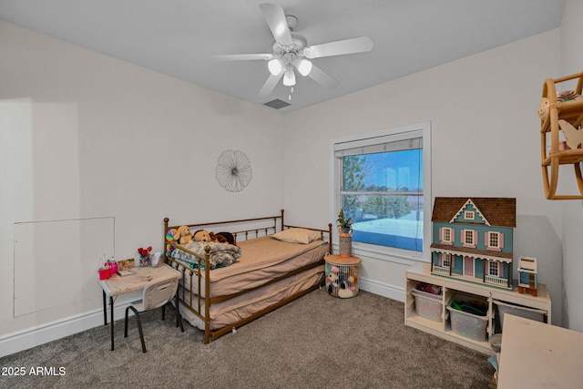 carpeted bedroom with baseboards and a ceiling fan