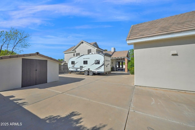 exterior space featuring a storage shed