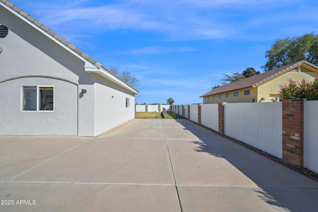 view of patio / terrace featuring fence