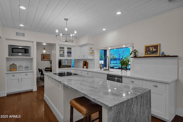 kitchen featuring visible vents, open shelves, appliances with stainless steel finishes, white cabinetry, and a notable chandelier