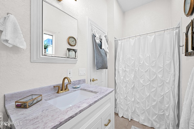 full bath featuring vanity and a shower with shower curtain