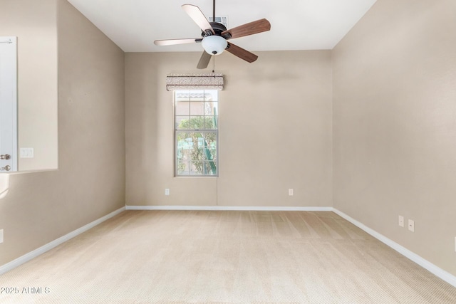 carpeted empty room with ceiling fan