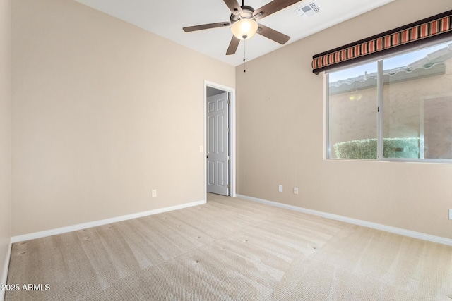 carpeted empty room featuring ceiling fan