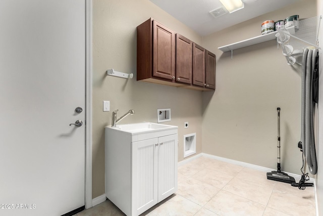 clothes washing area with cabinets, sink, washer hookup, hookup for an electric dryer, and light tile patterned floors