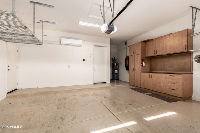 garage featuring electric water heater, a wall unit AC, and a garage door opener