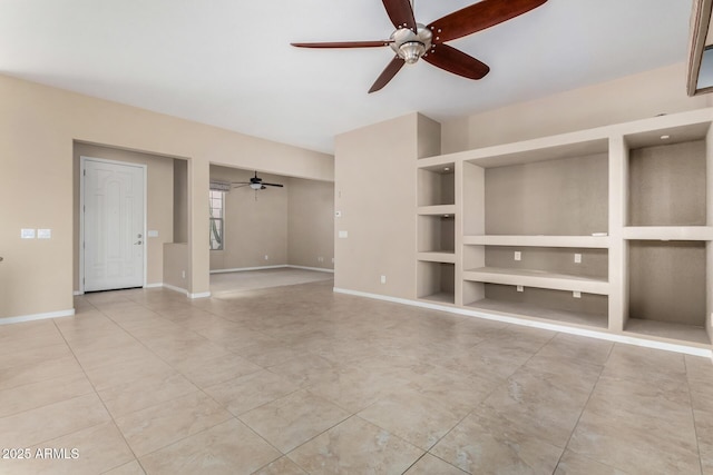 unfurnished living room with built in shelves, light tile patterned flooring, and ceiling fan