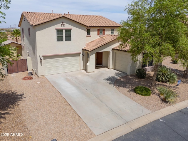 40232 W Marion May Ln, Maricopa, AZ 85138 - mediterranean / spanish home with stucco siding, driveway, a tile roof, and an attached garage
