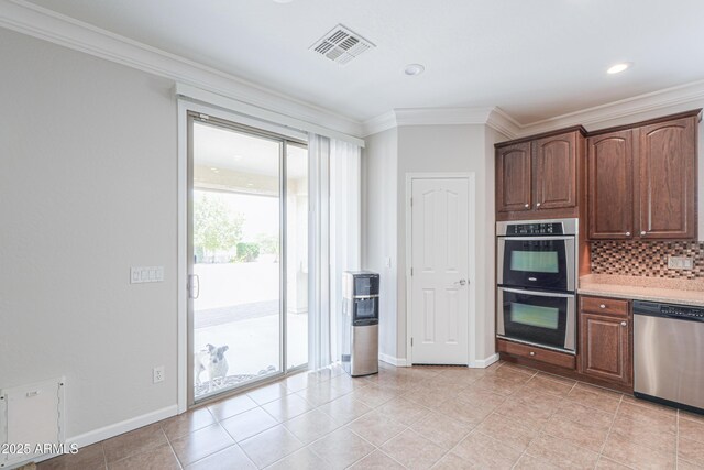 40232 W Marion May Ln, Maricopa, AZ 85138 - kitchen featuring appliances with stainless steel finishes, backsplash, baseboards, crown molding, and light tile patterned flooring