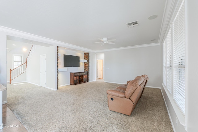 40232 W Marion May Ln, Maricopa, AZ 85138 - unfurnished living room with ceiling fan, carpet flooring, crown molding, baseboards, and stairs