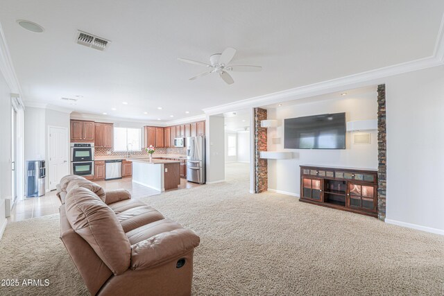 40232 W Marion May Ln, Maricopa, AZ 85138 - living area featuring ornamental molding, a ceiling fan, baseboards, light colored carpet, and recessed lighting