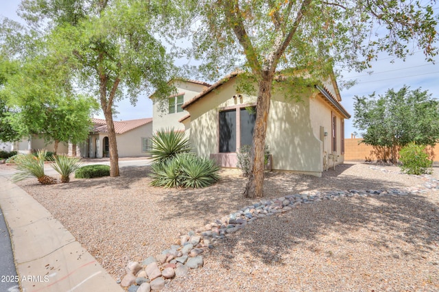 40232 W Marion May Ln, Maricopa, AZ 85138 - view of front of house featuring stucco siding, fence, and a tiled roof