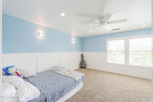 40232 W Marion May Ln, Maricopa, AZ 85138 - bedroom with recessed lighting, a wainscoted wall, carpet floors, a decorative wall, and ceiling fan