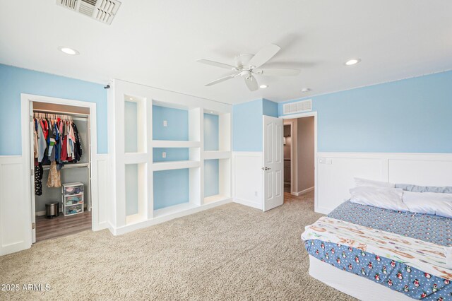 40232 W Marion May Ln, Maricopa, AZ 85138 - bedroom featuring carpet floors, a wainscoted wall, a spacious closet, a decorative wall, and a closet