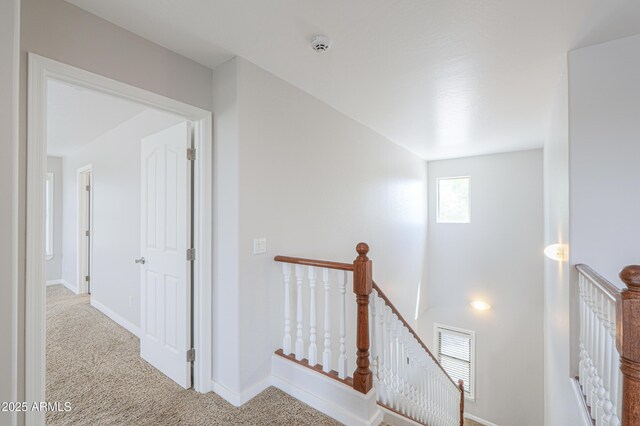 40232 W Marion May Ln, Maricopa, AZ 85138 - corridor featuring an upstairs landing, carpet flooring, and baseboards
