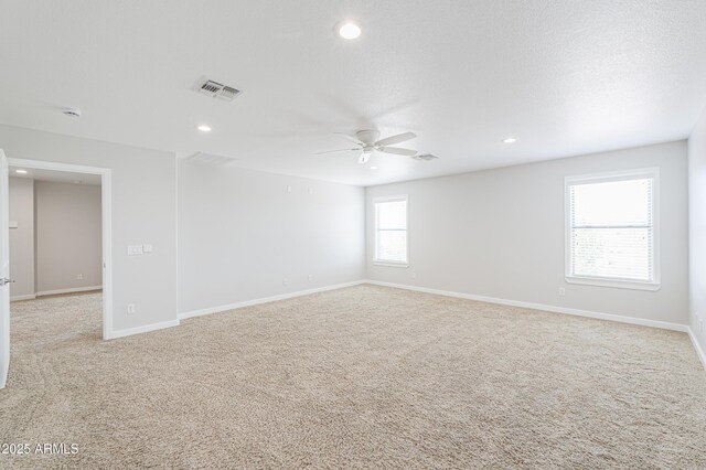 40232 W Marion May Ln, Maricopa, AZ 85138 - spare room with a ceiling fan, light carpet, recessed lighting, and baseboards