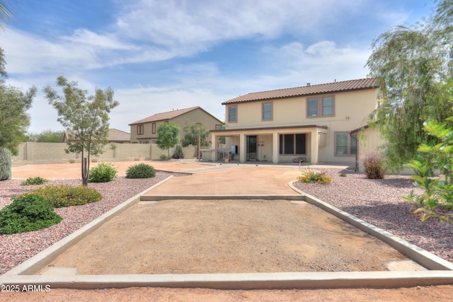 40232 W Marion May Ln, Maricopa, AZ 85138 - rear view of house featuring a patio area, fence, stucco siding, and a tiled roof
