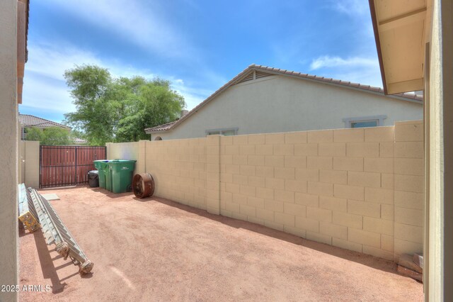 40232 W Marion May Ln, Maricopa, AZ 85138 - view of yard featuring fence and a patio area