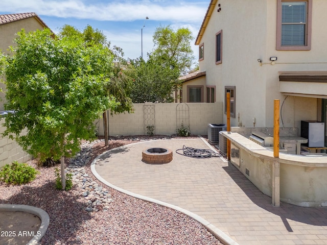 40232 W Marion May Ln, Maricopa, AZ 85138 - view of patio with a fire pit, fence, area for grilling, and cooling unit