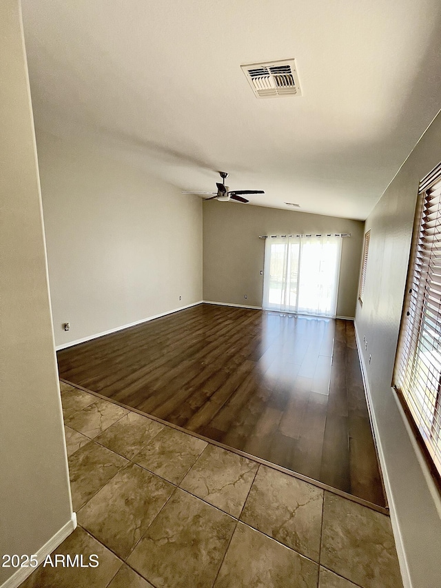 5749 S 247th Dr, Buckeye, AZ 85326 - spare room featuring a ceiling fan, baseboards, and wood finished floors