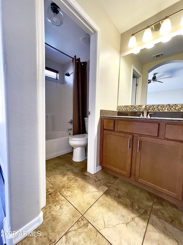 5749 S 247th Dr, Buckeye, AZ 85326 - full bath with a ceiling fan, toilet, vanity, bathing tub / shower combination, and tile patterned flooring