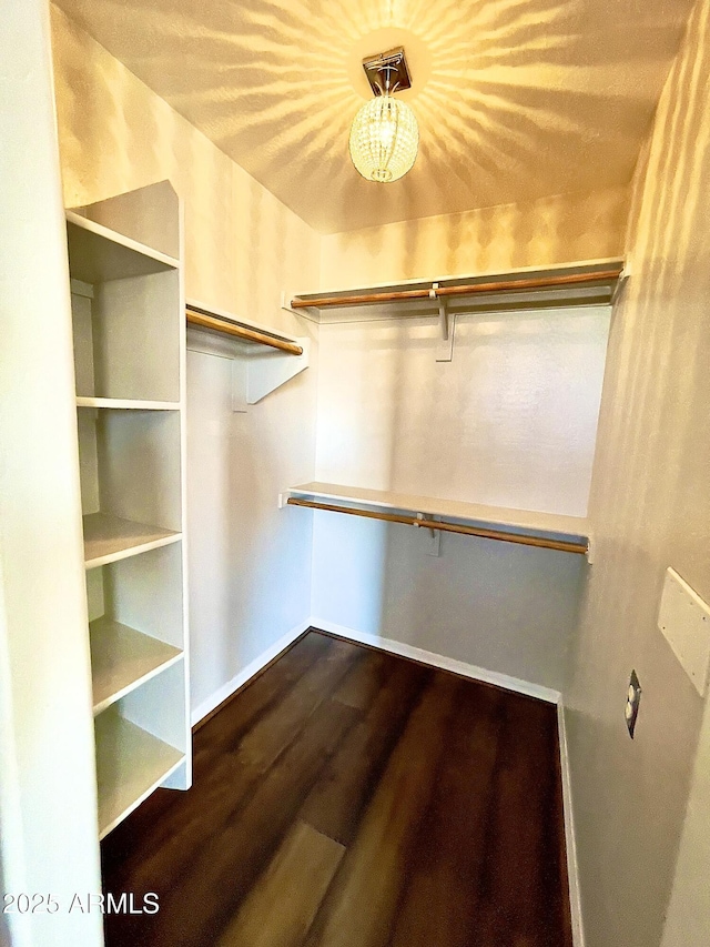 5749 S 247th Dr, Buckeye, AZ 85326 - walk in closet with dark wood-type flooring