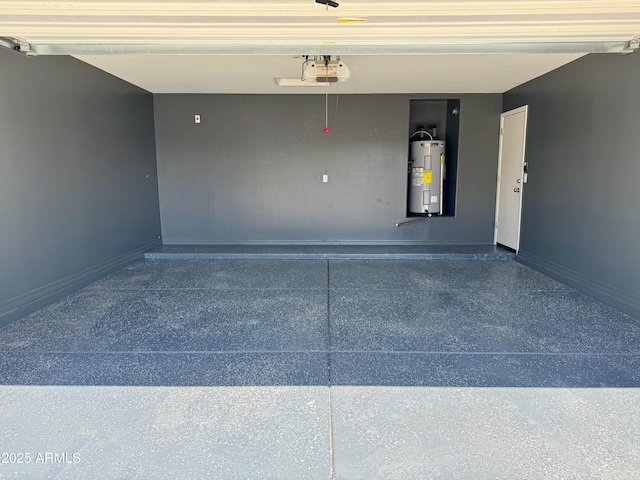 5749 S 247th Dr, Buckeye, AZ 85326 - garage featuring water heater, a garage door opener, and baseboards
