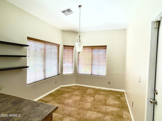 5749 S 247th Dr, Buckeye, AZ 85326 - unfurnished dining area with baseboards