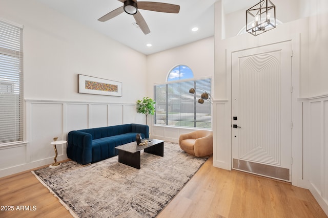 1748 E Cortez Dr, Gilbert, AZ 85234 - living area featuring wainscoting, a decorative wall, a ceiling fan, recessed lighting, and wood finished floors