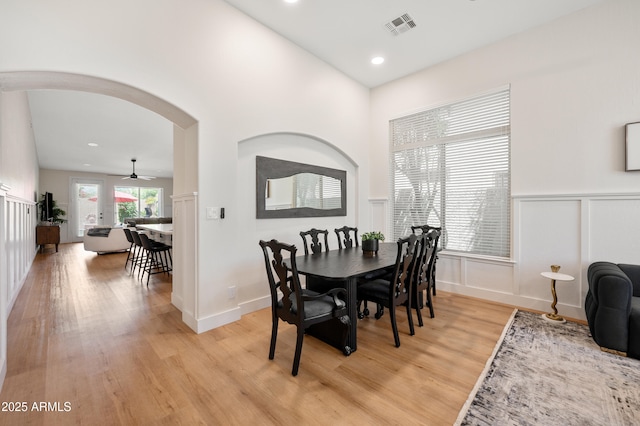 1748 E Cortez Dr, Gilbert, AZ 85234 - dining area with visible vents, a ceiling fan, recessed lighting, light wood-type flooring, and arched walkways