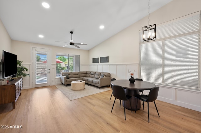 1748 E Cortez Dr, Gilbert, AZ 85234 - living room with a wainscoted wall, light wood finished floors, ceiling fan with notable chandelier, and a decorative wall