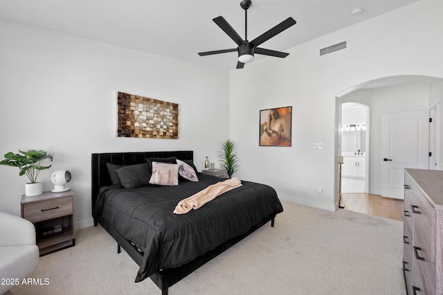 1748 E Cortez Dr, Gilbert, AZ 85234 - bedroom with light carpet, arched walkways, a ceiling fan, baseboards, and visible vents