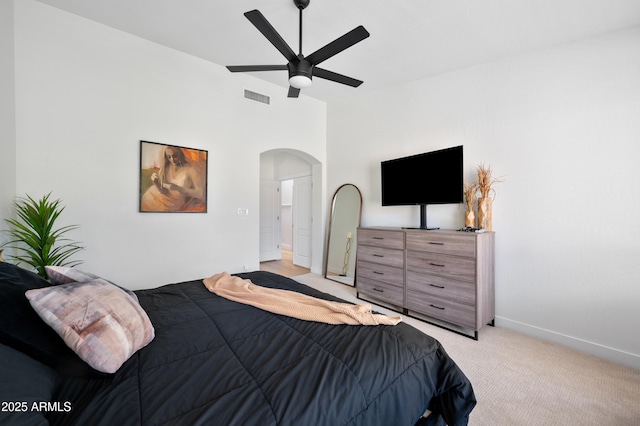 1748 E Cortez Dr, Gilbert, AZ 85234 - bedroom featuring light carpet, arched walkways, a ceiling fan, baseboards, and visible vents