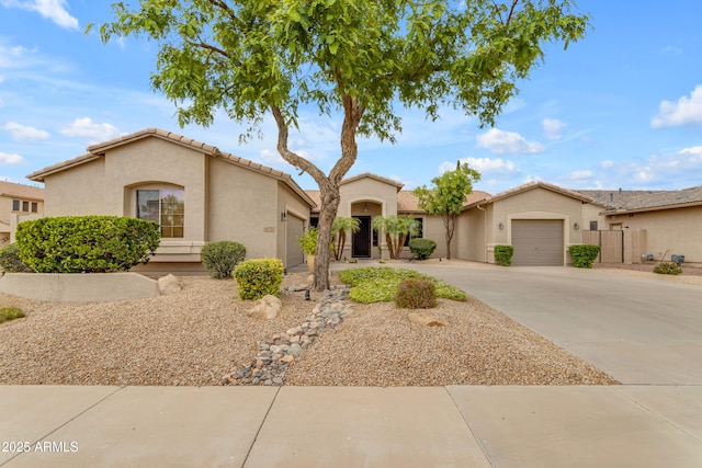 6870 S Justin Way, Chandler, AZ 85249 - mediterranean / spanish-style home featuring a garage, concrete driveway, and stucco siding